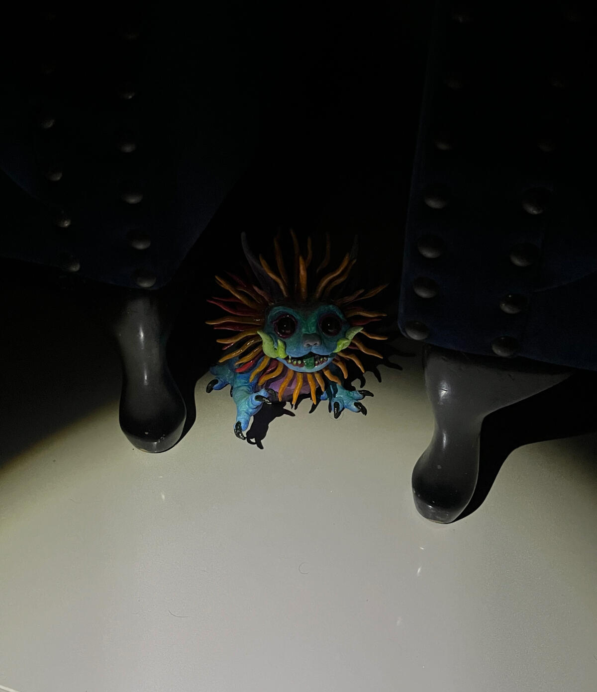 "The Fortune Warden awakens at night" "TKC003 sculpture glowing with dual light response in darkness"